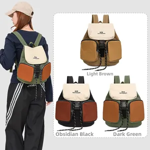 Detail view of stylish hiking backpack showing color options and buckle closure detail