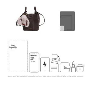 Detail of dark brown bucket bag capacity showing items like phone and umbrella
