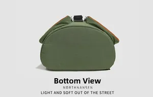 Detail view of the durable canvas bottom and leather trim of the outdoor backpack