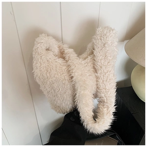 Detail of soft beige plush faux fur shoulder bag with high-quality lamb wool texture