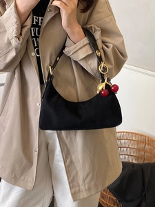 Large black suede hobo bag for women with cherry charm and metal eyelet shoulder strap