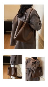 Three-way view of a large brown minimalist tote bag with shoulder straps and metal studs