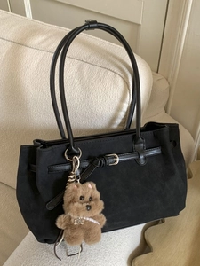 Retro black suede tote bag with leather handles and cute plush puppy charm accessory