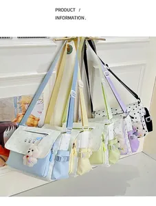 Detail of colorful canvas messenger bags with star patterns and plush bear charms
