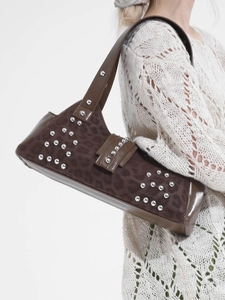 Women's leopard print shoulder bag with silver rivets and vintage motorcycle style aesthetic