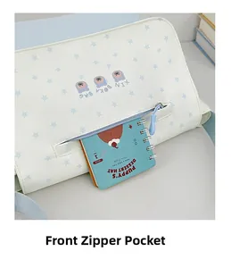 Front zipper pocket of star pattern tote bag showing capacity with a notebook inside