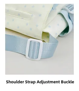 Detail of adjustable blue woven shoulder strap with white buckle on star pattern tote bag