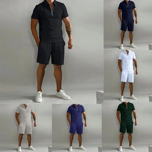 Detail view of men's polo set showcasing multiple colors and zipper collar design