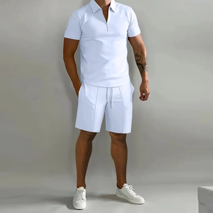 Detail of light blue short sleeve polo set with zippered collar and drawstring shorts