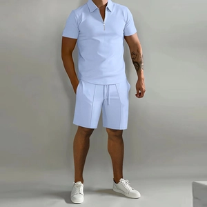 Close-up of light blue polo set featuring a zip-up collar and matching drawstring shorts