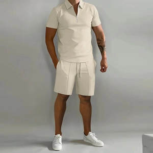 Close-up of men's waffle knit beige polo shirt and drawstring shorts casual summer set