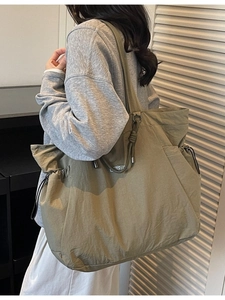 Olive green large capacity tote bag with drawstring detail for commute and travel