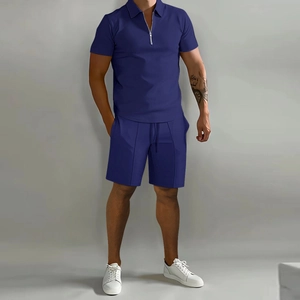 Close-up of navy blue men's polo set with half-zip waffle knit texture and drawstring