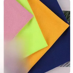 Detail showing the breathable mesh texture of quick-dry athletic shorts in multiple colors