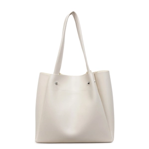 Minimalist beige tote bag with large capacity, pebbled leather texture, and silver rivets