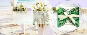 Detail of laser cut green wedding invitation with elegant silk bow and floral lace pattern