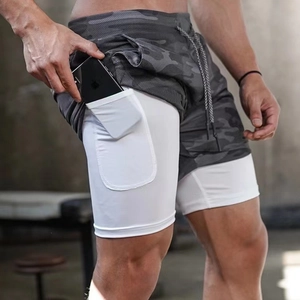 Close-up of men's camouflage 2-in-1 shorts featuring a built-in phone pocket on the liner