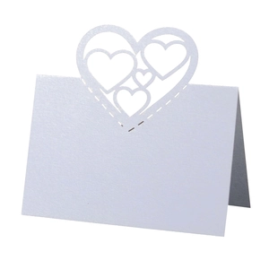 Elegant white laser-cut hollow heart table card for weddings and event seating decoration