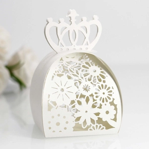 Detailed laser-cut pattern on white crown-shaped wedding favor candy gift box