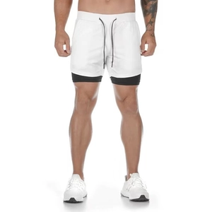 Detail of men's double-layer athletic shorts featuring white mesh and black compression liner