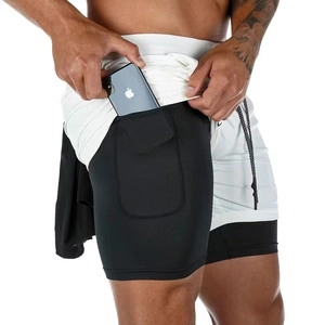 Detail of men's gym shorts featuring a built-in phone pocket and double-layer design