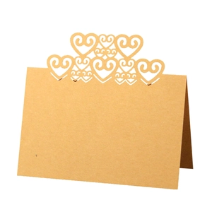 Brown hollow heart laser cut place cards for wedding tables in kraft paper material