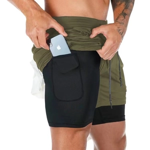 Detail of double-layer fitness shorts featuring a phone pocket and breathable mesh fabric