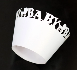 Detailed laser-cut baby carriage cupcake wrapper in white for baby shower decor