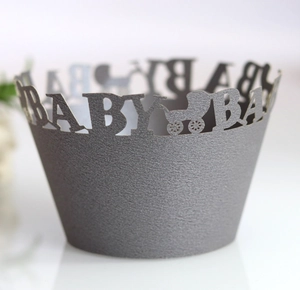 Detailed laser-cut baby shower cupcake wrapper with baby carriage and BABY text
