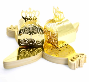 Detailed laser-cut crown candy boxes in gold finish for wedding and party favor packaging