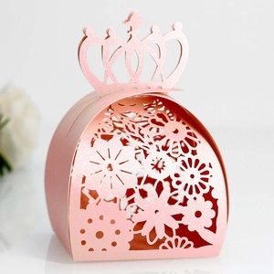 Detailed laser-cut candy box with pink crown design and intricate floral pattern