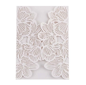 Intricate laser-cut floral patterns on a white wedding invitation cover sleeve