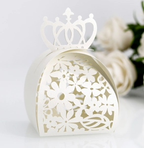 Detailed laser-cut floral pattern and crown handle on white pearl paper favor box