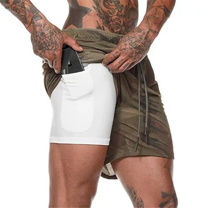 Detail showing two-in-one men's shorts with camo mesh and inner phone pocket