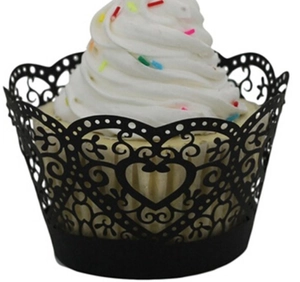 Detail of laser-cut black heart vine pattern cupcake wrappers for elegant party decoration