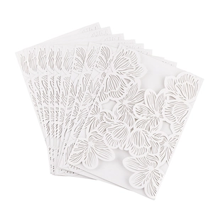 Laser cut white rose invitation covers stacked in fan shape for weddings and parties