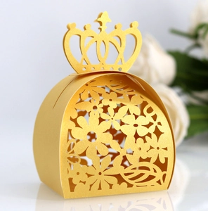 Detailed laser-cut hollow crown candy box with elegant floral patterns in gold pearlescent