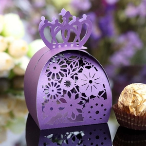 Detail of laser-cut purple candy box with crown top and elegant floral patterns