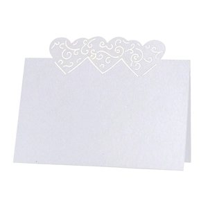 White laser cut heart place cards with scroll pattern for wedding table setting