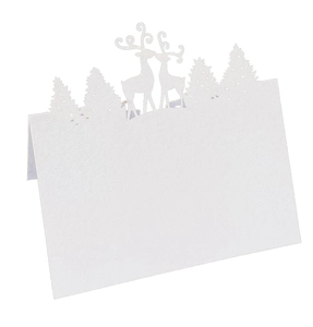 Detailed laser-cut reindeer and forest design on a white kraft paper wedding place card