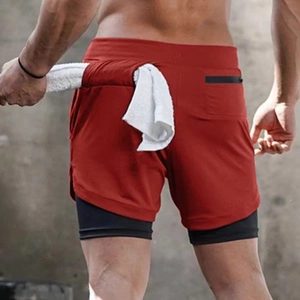 Detail of red quick-dry athletic shorts with towel loop and hidden back zipper pocket