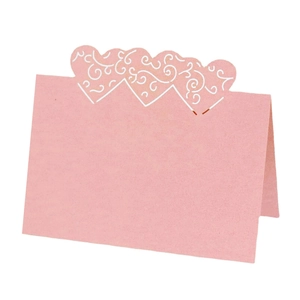 Pink heart laser cut place card with elegant white scroll pattern for wedding table