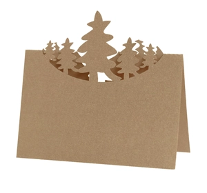 Detail of kraft paper 3D Christmas table card with hollowed-out pine tree design