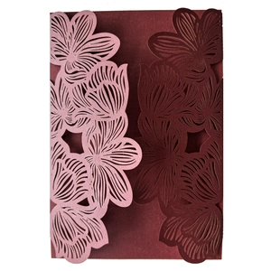 Detailed laser cut floral pattern showing high precision on a wedding invitation cover