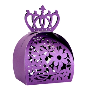 Macro detail of purple pearlescent paper candy box with laser-cut floral crown design