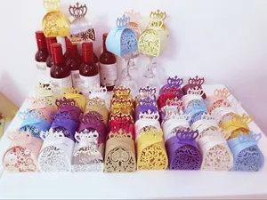 Detailed laser-cut candy boxes with crown design and floral patterns for weddings