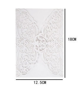 Detailed laser-cut white invitation card with intricate floral patterns measuring 18x12.5cm