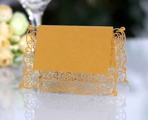 Elegant gold laser-cut butterfly place cards with glitter texture for wedding table decor