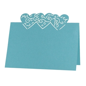 Sky blue laser-cut heart place card with elegant hollow pattern for wedding table