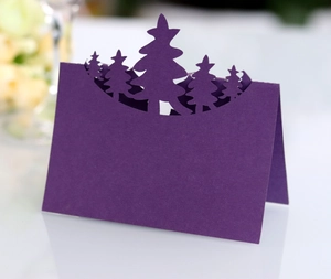 Detailed laser-cut purple place card featuring a festive 3D Christmas tree silhouette